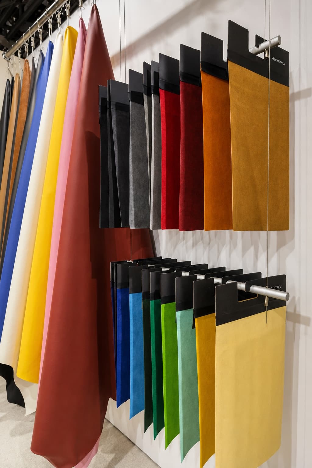 A colour display of Alcantara material samples at the CAMARI booth